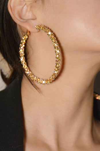 Runde Ohrringe mit goldenen Strasssteinen