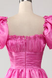 Pinkfarbenes Ballkleid mit Puffärmeln und Rüschen